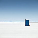 Blue portable toilets on the textured ground in Bonneville Salt Flats, USA. 