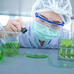 Close-up of a female scientist experimenting in a laboratory.